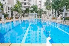 Cozy 2BR at Waterplace Apartment By Travelio Swimming pool